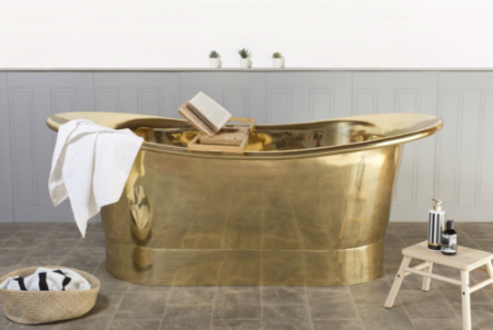 Vintage bathtub in polished brass